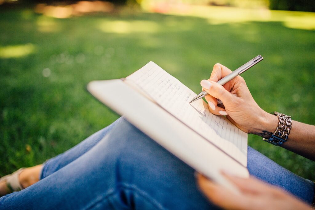 writing, writer, notes, pen, notebook, book, girl, woman, nature, people, hands, grass, outdoors