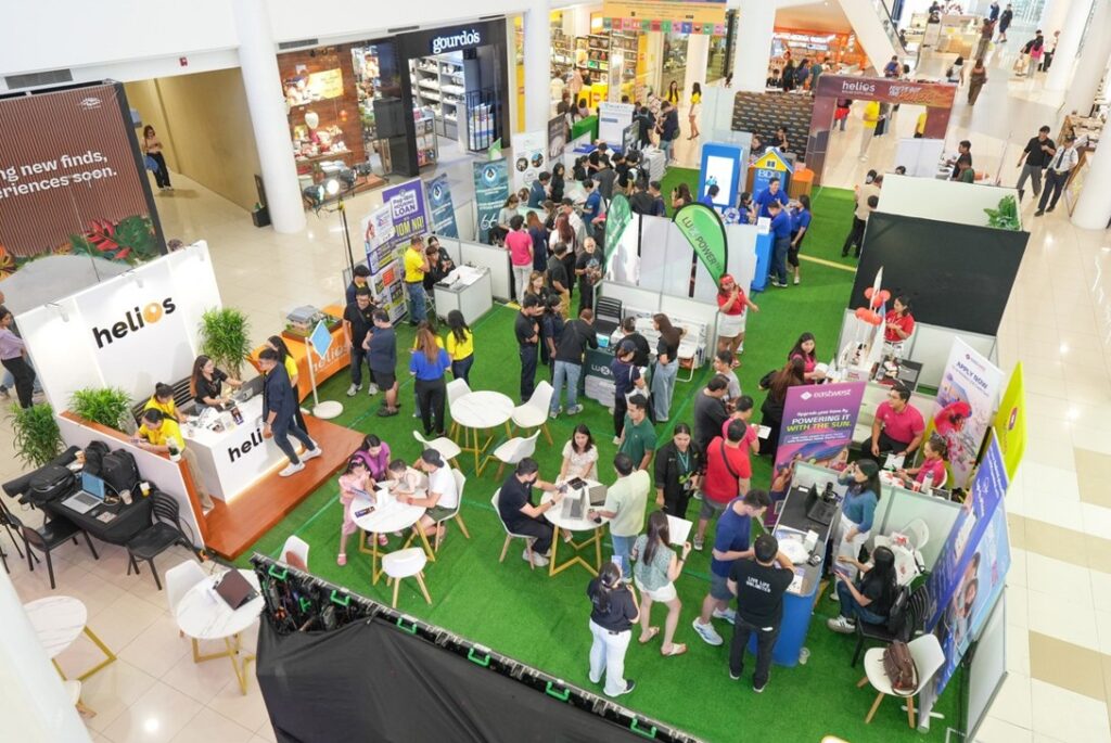 (3) visitors explore booth exhibits and consult with helios financial and industry partners